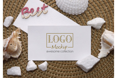 Logo Mockup on white stones and seashels design