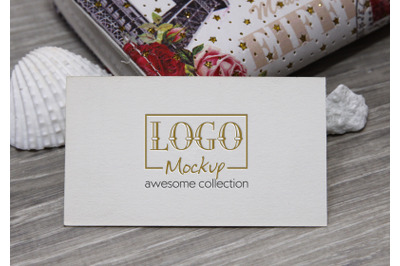 Logo Mockup with white stones and seashels
