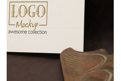 Logo Mockup with vintage clip on leather background