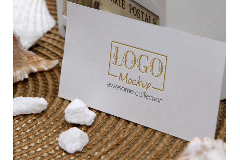 logo-mockup-on-white-stones-and-seashels