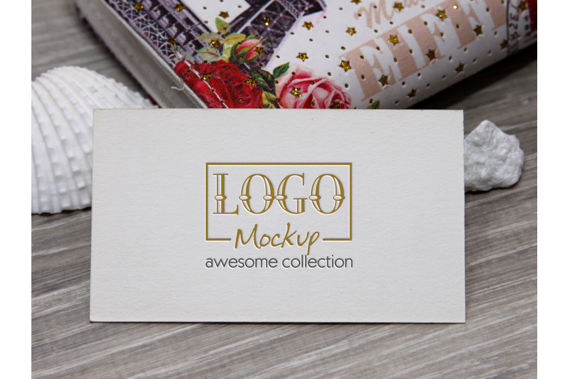 logo-mockup-with-white-stones-and-seashels-design